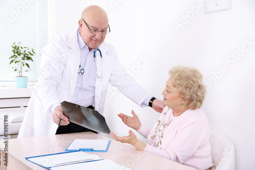 Doctor and patient in hospital clinic