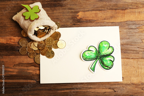 Greeting card for Saint Patrick's Day with shamrock and bag of