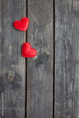 red hearts on rustic wood