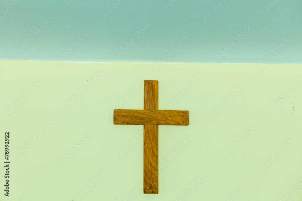 Old wooden cross on wall