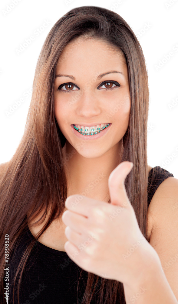 Smiling teenager girl with brackets saying Ok Smiling teenager girl with brackets saying Ok