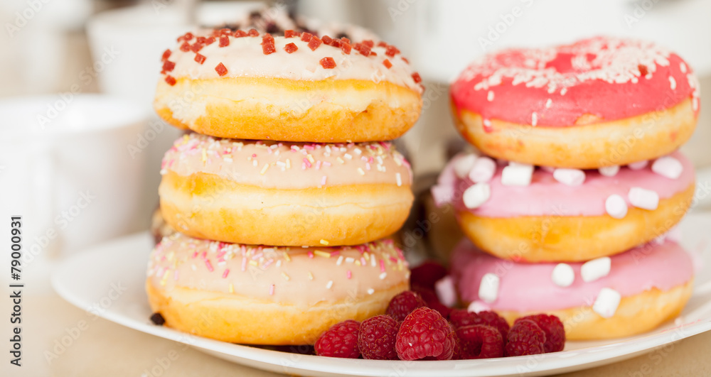 donuts on white plate.
