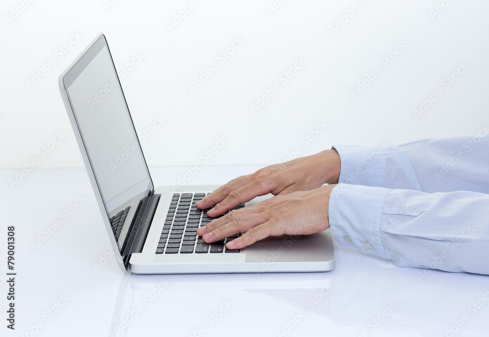 Businessman hands typing on keyboard laptop computer Businessman hands typing on keyboard laptop computer
