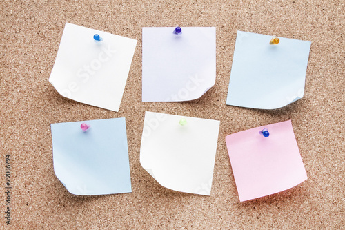 blank notes and multicolored thumbtacks