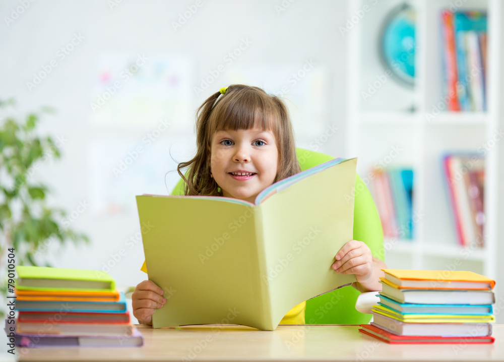 kid girl with opened book at home kid girl with opened book at home