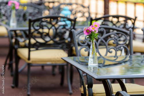 quiet cafe with vintage flowers on the table