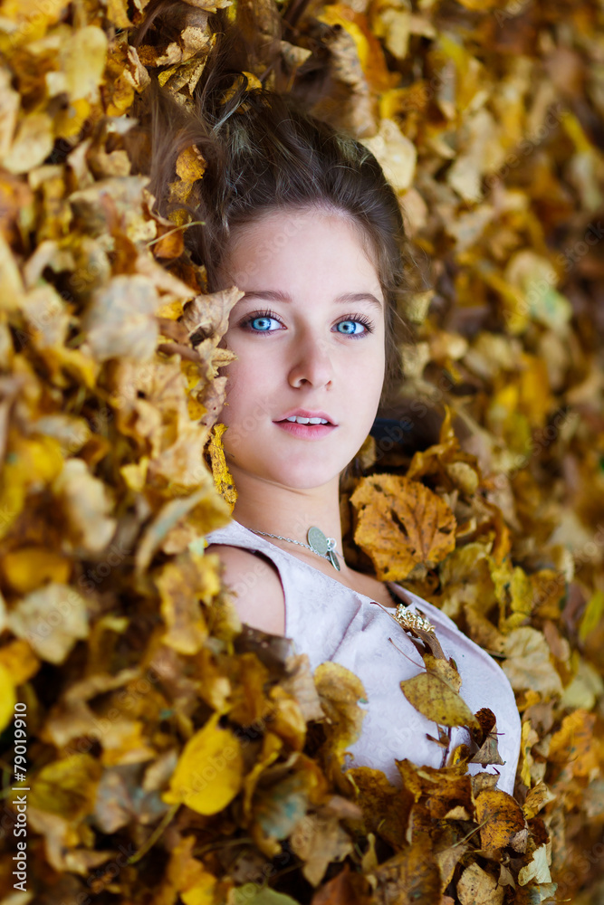 Beautiful girl in a yellow leaves Beautiful girl in a yellow leaves