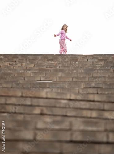 Little girl walking upstairs