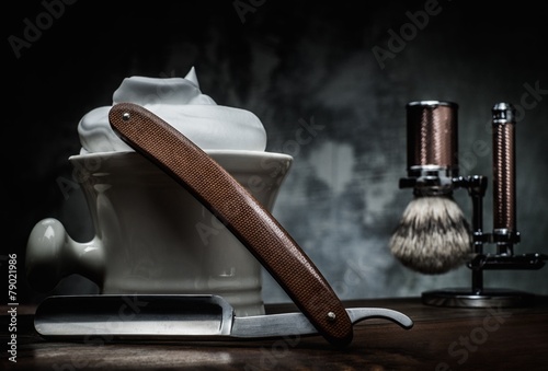 Фотография Shaving accessories on a luxury wooden background