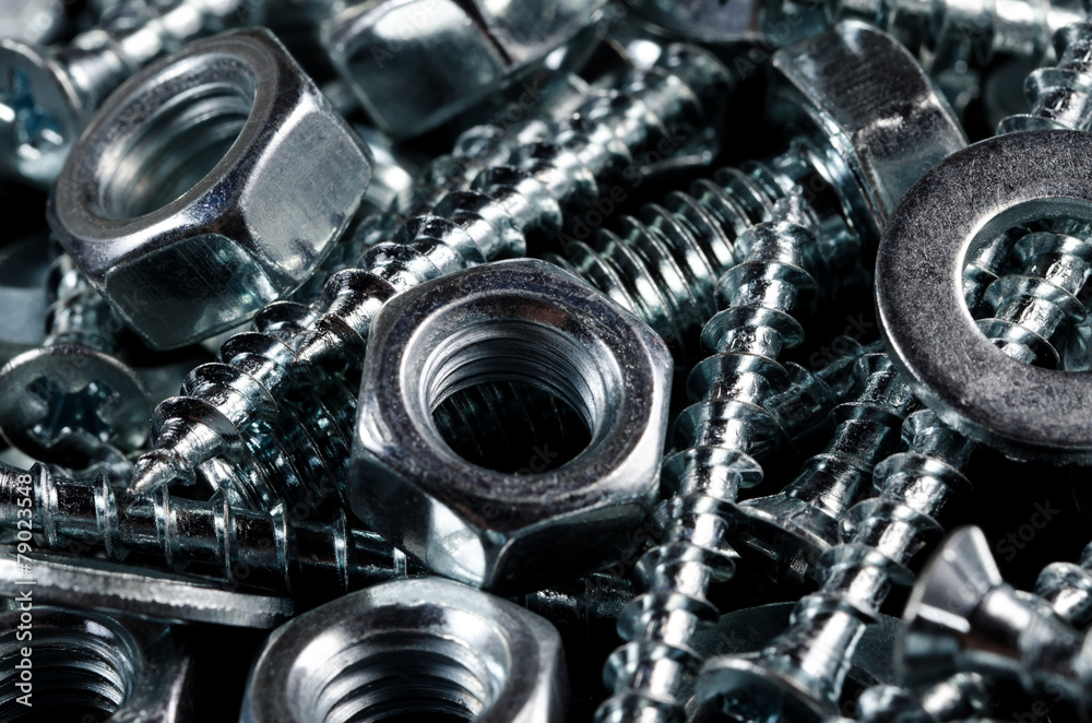 Couple on screws, bolts and nuts. Macro shot. Background. Couple on screws, bolts and nuts. Macro shot. Background.