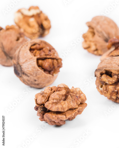 Heap of cracked walnuts.