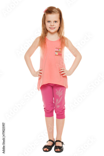 Full length a cheerful little girl in shorts and a T-shirt © nikolas_jkd