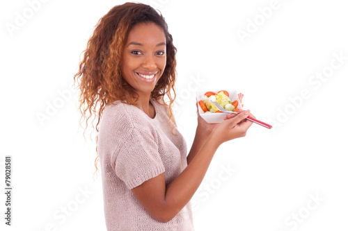 African American woman eating salad, isolated on white backgroun