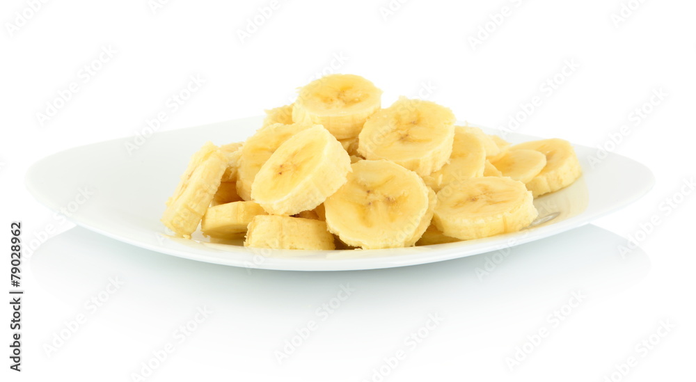 Macro shot of slices of banana on plate on white