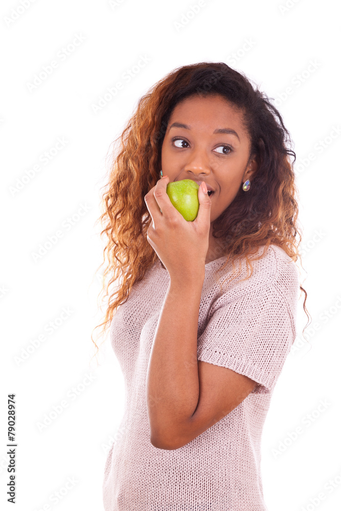 African Americanyoung woman eating one green apple - Black peopl African Americanyoung woman eating one green apple - Black peopl