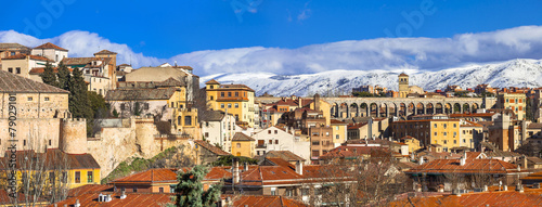panoramic view of Segovia with aqueduct and mountains, Spain