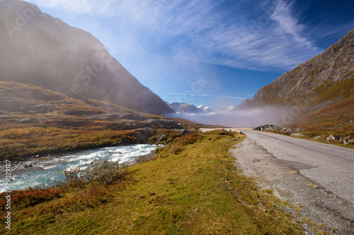 sunny and foggy road in Norway Gamle Strynefjellsvegen