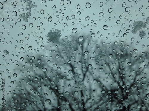 ice droplets and snow at window