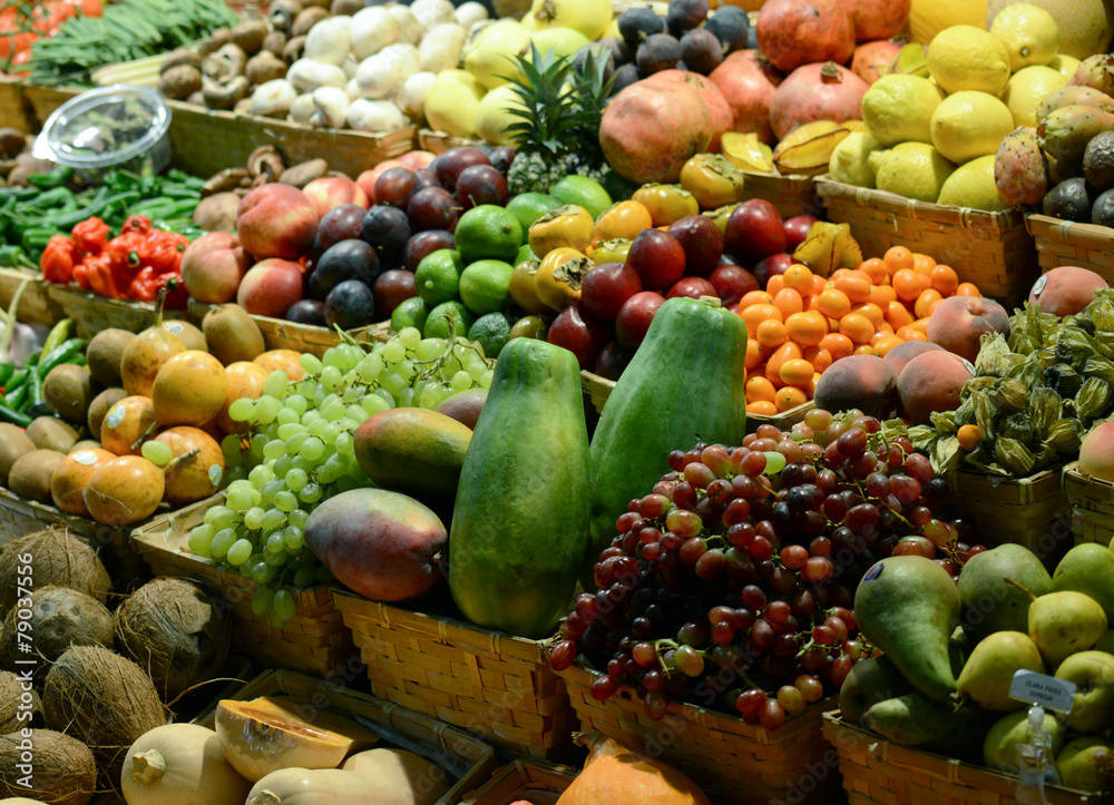 Fruit market with various colorful fresh fruits and vegetables -