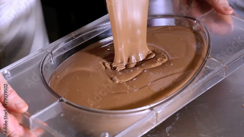 pastry chef working chocolate Easter eggs