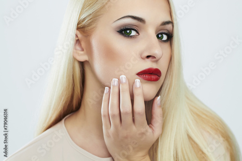 Blond woman with manicure.Beautiful girl with evening make-up