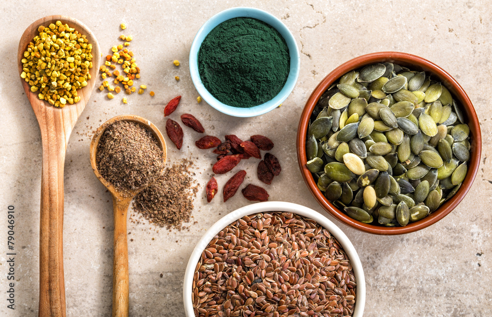 various superfoods on kitchen table various superfoods on kitchen table