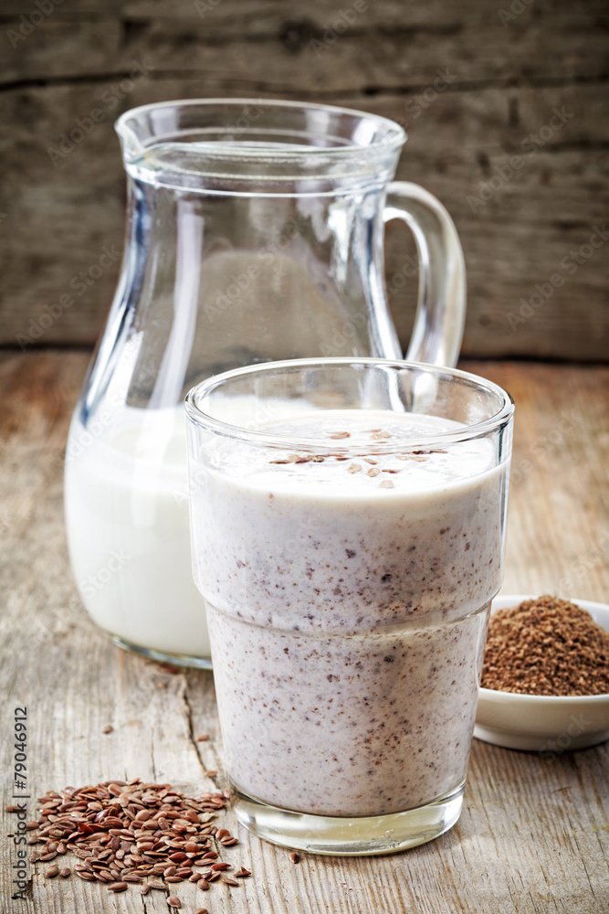 Glass of greek yogurt with crushed flax seeds Glass of greek yogurt with crushed flax seeds