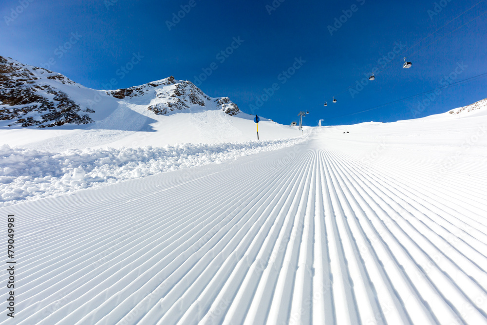 Plakat Newly groomed ski slope on a sunny day