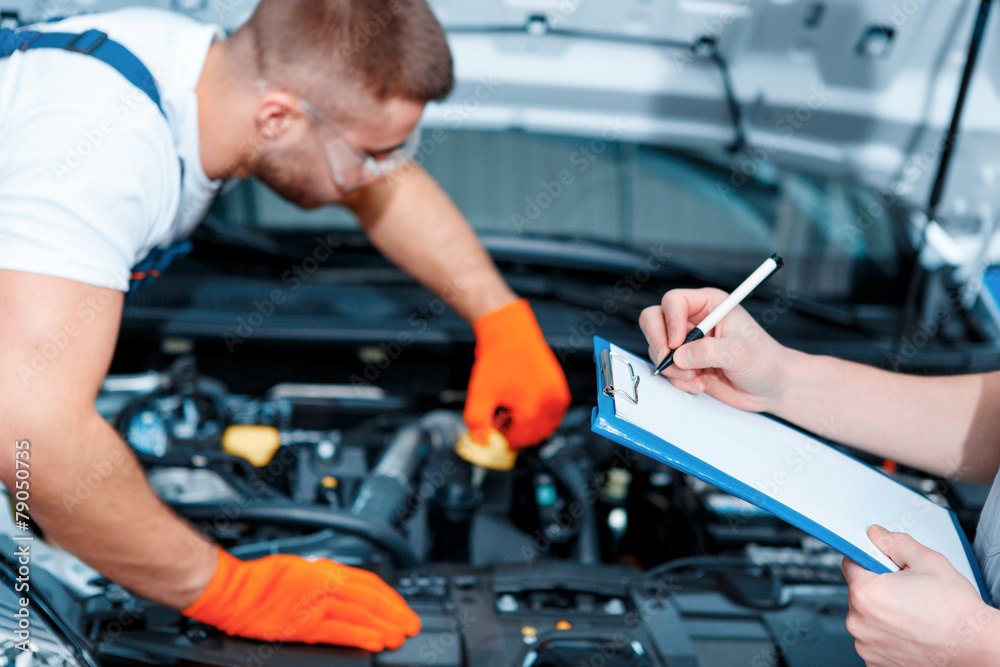 Car mechanics at the service station