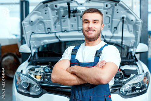 Car mechanic at the service station