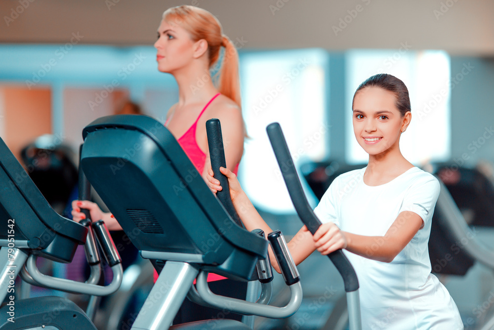 Cute teenage girl and her mom at sports club Cute teenage girl and her mom at sports club