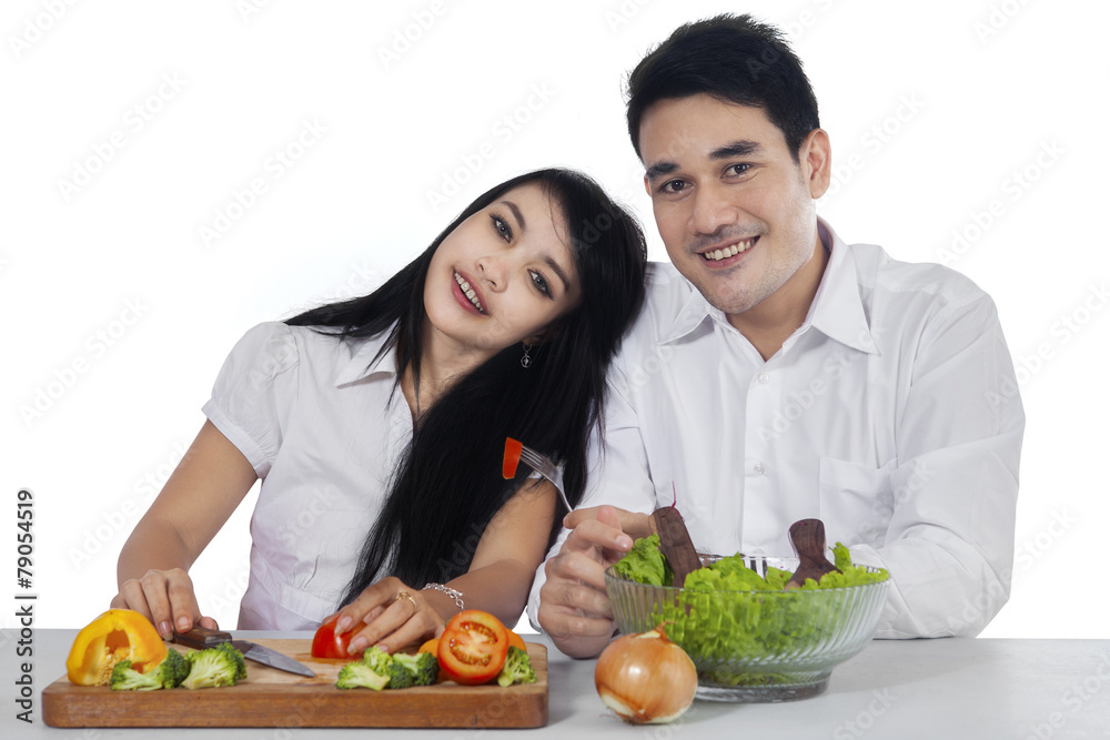 Vegetarian couple with fresh vegetables