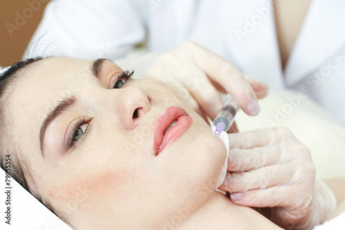 Woman Having Botox Treatment At Beauty Clinic