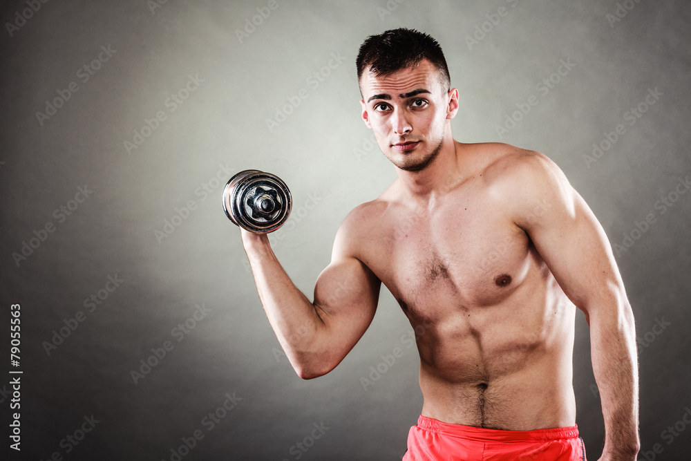 athletic man working with heavy dumbbells athletic man working with heavy dumbbells