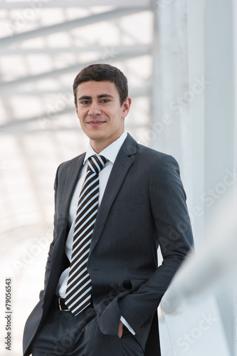 Portrait of handsome confident young businessman