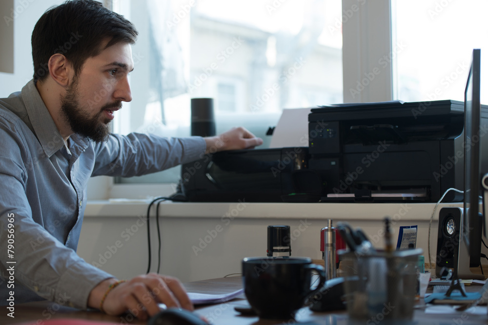 Businessman scanning and printing document