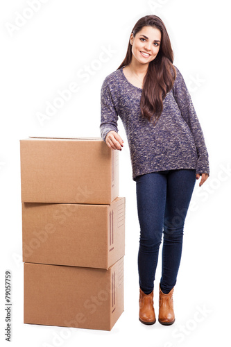 Pretty girl with pile of boxes