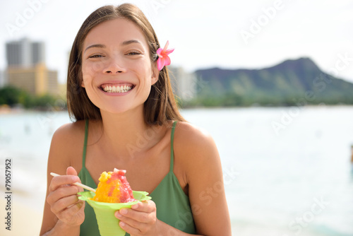 Hawaii woman on Waikiki eating Hawaiian shave ice