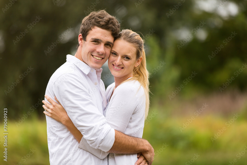 young couple hugging close up