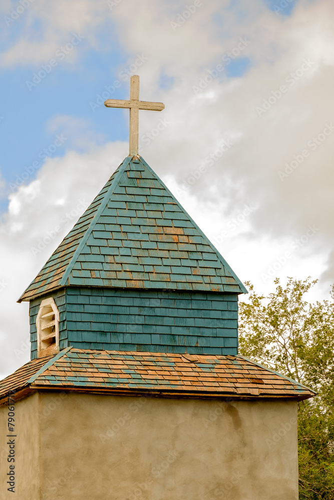 Cross and steeple on an old church