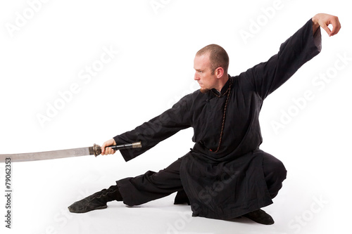 Martial arts teacher with sword out