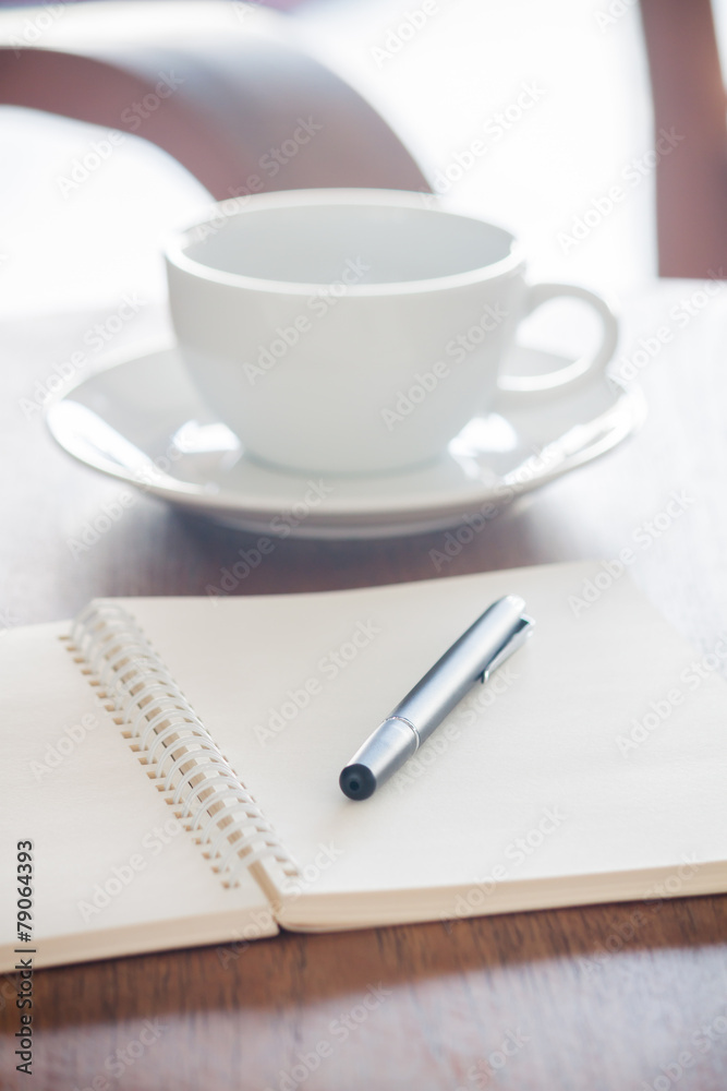 Blank notebook with pen on wooden table Blank notebook with pen on wooden table