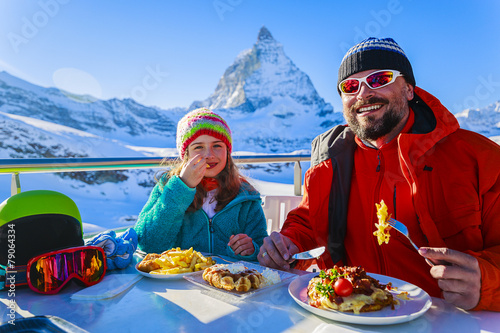 Winter, ski - skiers enjoying break for lunch