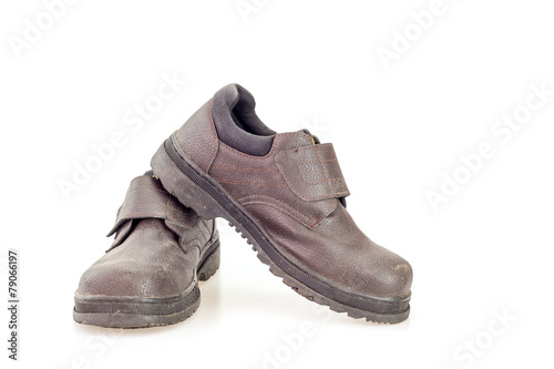 Old black safety shoe for worker