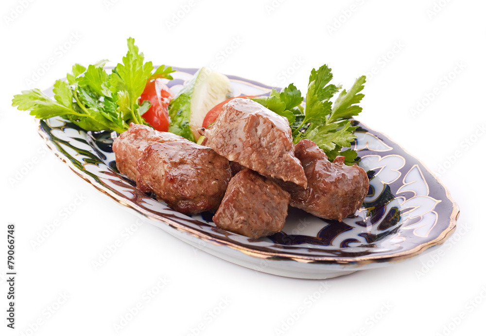 Meat on a grill with vegetables Meat on a grill with vegetables