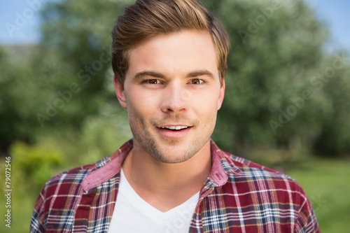 Handsome hipster smiling at camera