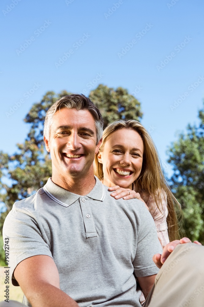 Happy couple relaxing in the park Happy couple relaxing in the park