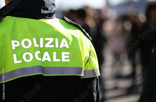 Italian policeman with police uniform patrol the city photo