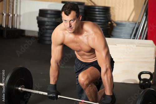 crossfit training man with barbell