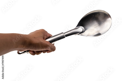 Hand with cooking spoon